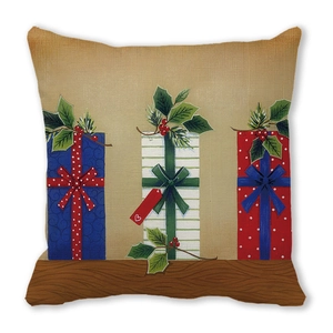 Détail macro de housse de coussin de Noël avec cadeaux imprimés et tissu texturé