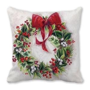 Christmas wreath cushion cover with red berries and bow on soft peach skin fabric