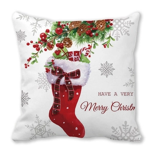 Housse de coussin de Noël avec chaussettes festives et pommes de pin sur tissu blanc