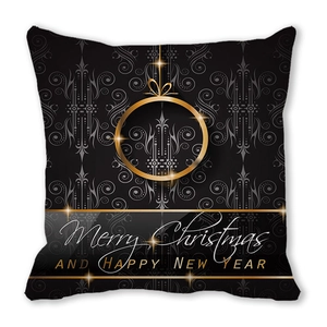 Close-up of Christmas cushion cover with golden ornaments and Merry Christmas print
