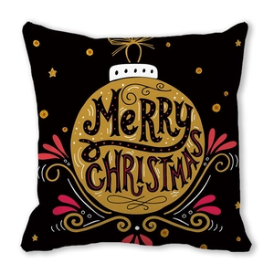 Close-up of black Christmas pillowcase with golden Merry Christmas bauble print