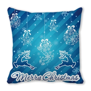 Close-up of Christmas pillowcase with blue reindeer, snowflakes and Merry Christmas text