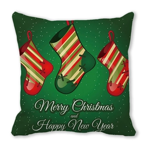 Detail of green Christmas pillowcase with festive stockings and holiday greetings