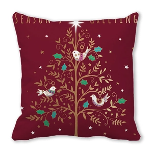 Close-up of Season's Greeting pillow cover with a golden Christmas tree on dark red fabric