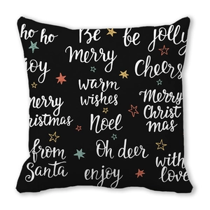 Close-up of Christmas pillowcase with holiday greetings and stars on black peach skin fabric