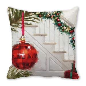Detail of artistic Christmas pillowcase featuring a red bauble and festive home scene