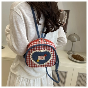 Quilted red and white checkered mini backpack featuring heart patch and lace details