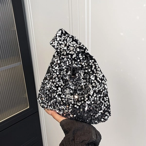 Sparkling sequin wrist bag in geometric triangle shape for evening parties and events