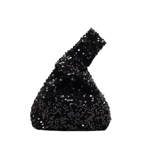 Elegant black sequin knot handbag with sparkling finish for evening wear and parties