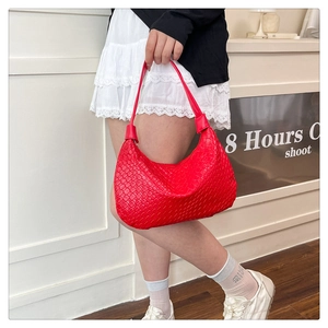 Detailed view of red woven texture and crescent shape on large capacity PU hobo bag