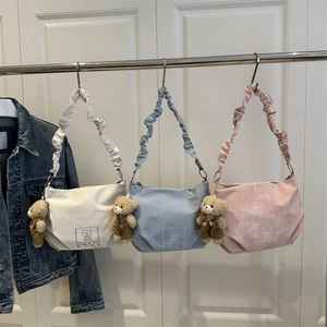 Stylish pastel canvas handbags with pleated straps and cute brown bear charms
