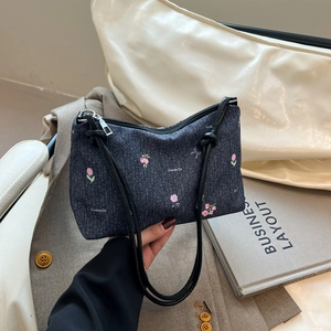 Denim tote bag with floral cat embroidery and slim black straps for daily commute