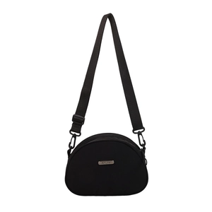 Minimalist black crescent nylon crossbody bag with adjustable strap and metal tag logo