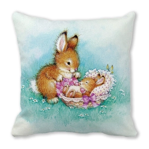Detailed close-up of a decorative cushion cover with hand-painted rabbit illustration
