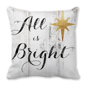 Close-up of All is Bright Christmas pillow cover with white wood texture and gold star