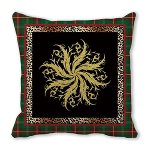 Detail of Christmas pillow cover featuring leopard print and vintage gold floral patterns