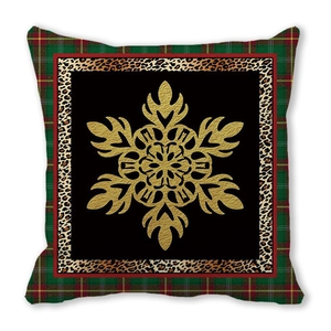 Detail of Christmas pillowcase with golden snowflake, leopard print, and tartan borders