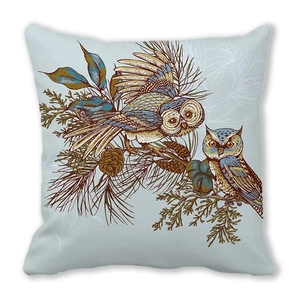 Close-up of owl and pine branch illustration on soft peach skin fabric cushion cover
