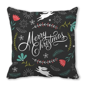 Close-up of black Christmas pillow cover with white Merry Christmas text and rabbit