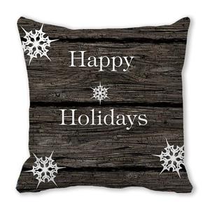 Detail of Happy Holidays pillowcase featuring brown wood texture and white snowflake patterns