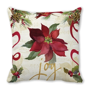 Detail of Christmas pillowcase with red poinsettia floral patterns and gold Joy script