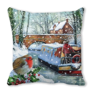 Close-up of peach skin fabric cushion cover with printed winter robin and cottage scene