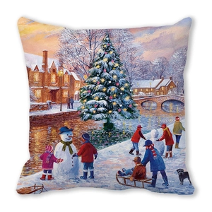 Detailed texture of peach skin fabric featuring a snowy Christmas village scene on cushion cover
