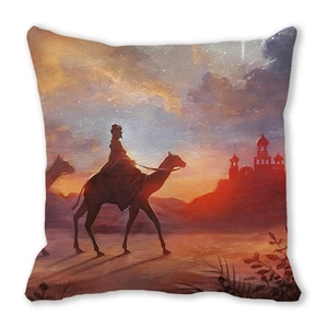 Close-up of peach skin cushion cover featuring desert sunset landscape with camel silhouette