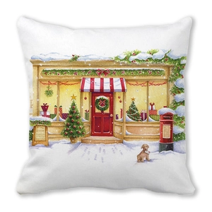 Detail of Christmas watercolor cushion cover showing a snow-covered shop and a dog