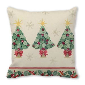 Detailed texture of peach skin fabric with three holly leaf Christmas trees and red berries