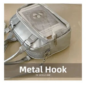 Close-up of durable silver metal zipper and hardware hooks on a clear window ita bag