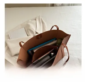 Top view of a large brown tote bag showing its spacious interior and high capacity