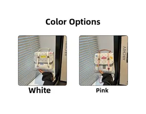 Detail of small square crossbody bags in white and pink with polka dots and cartoon patches