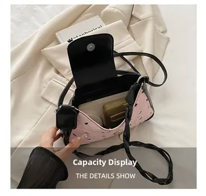 Internal view of pink quilted bag showing space for wallet, phone and cosmetics