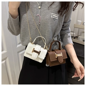 Mini crossbody bags in white and brown with gold metal buckles and chain straps