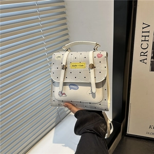 Minimalist polka dot faux leather crossbody bag with top handle for daily casual use