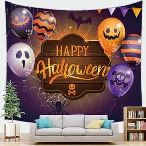 Detail of Halloween tapestry with Happy Halloween text, pumpkins, and bats on living room wall