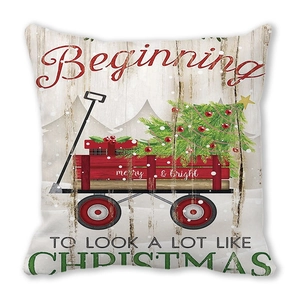 Detail of Christmas pillowcase with vintage red cart and pine tree print on peach skin fabric