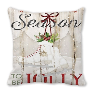 Macro detail of retro Santa Christmas cushion cover with ice skates and holly berries