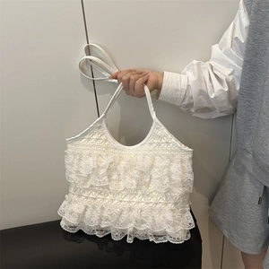 Elegant white lace tote bag with tiered ruffle design for summer beach vacations
