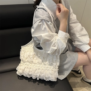 White lace tote bag with tiered ruffles and chain strap for summer vacations