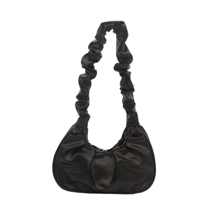 Fashionable black dumpling cloud bag with pleated shoulder strap on white background