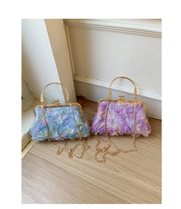 Detail of blue and purple pleated petal evening bags with gold ring handles