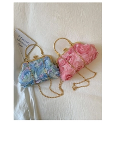 Detail of 3D fabric flower evening bags with gold metal handles and detachable chains