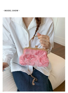 Detail show of pink pleated petal evening bag with gold hollow handle and mesh flowers
