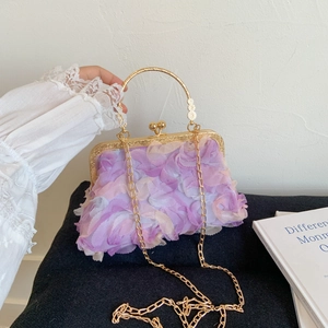 Elegant evening clutch with purple 3D floral petals, golden handle, and metal chain