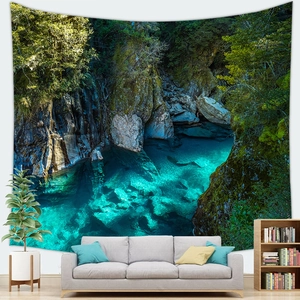 Detail of mountain stream tapestry showing clear green water and rocks on living room wall