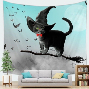 Detail of Halloween tapestry with black cat on broom against blue sky in a cozy living room