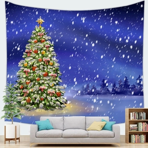 Christmas tree tapestry with starry night background hanging above a modern living room sofa