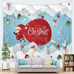 Detail of Christmas tapestry with 3D paper cut style Santa Claus over a grey sofa